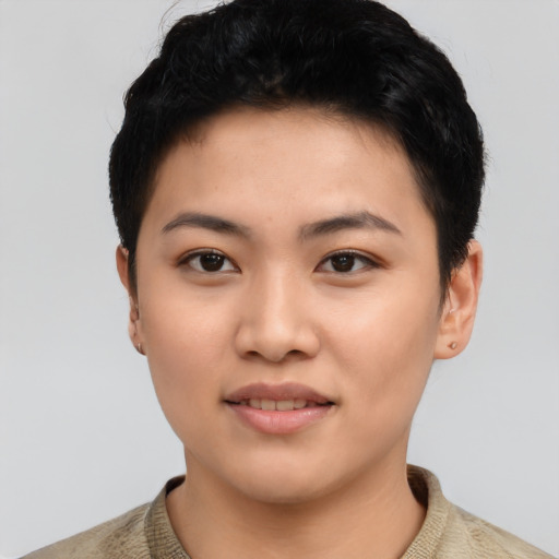 Joyful asian young-adult female with short  black hair and brown eyes