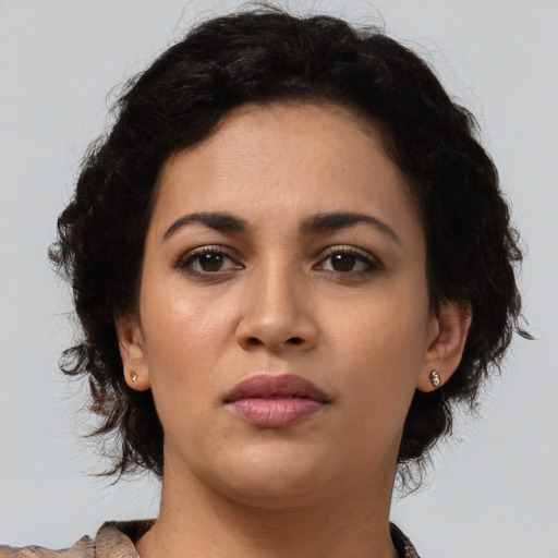 Neutral latino young-adult female with medium  brown hair and brown eyes