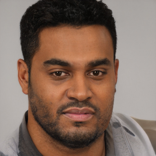 Neutral black young-adult male with short  brown hair and brown eyes