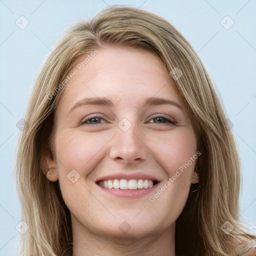 Joyful white young-adult female with long  brown hair and blue eyes