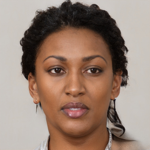 Neutral latino young-adult female with short  brown hair and brown eyes