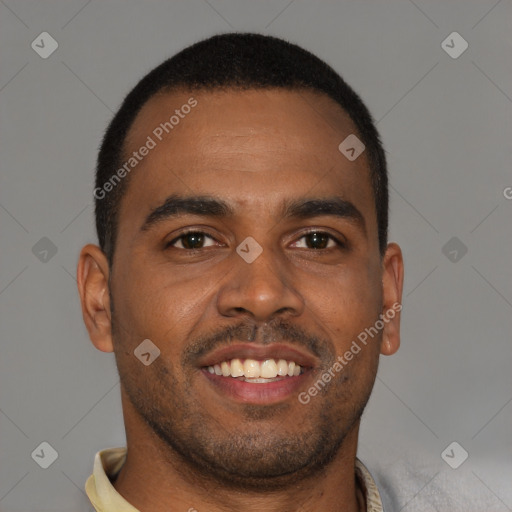 Joyful black young-adult male with short  brown hair and brown eyes