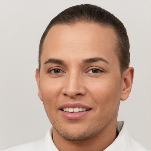 Joyful white young-adult male with short  brown hair and brown eyes