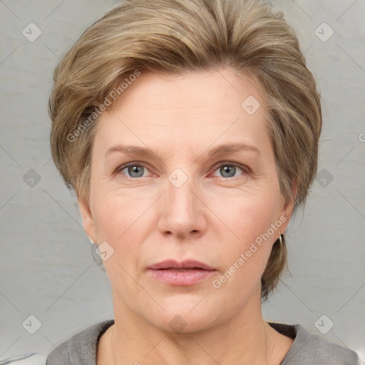 Neutral white adult female with medium  brown hair and grey eyes