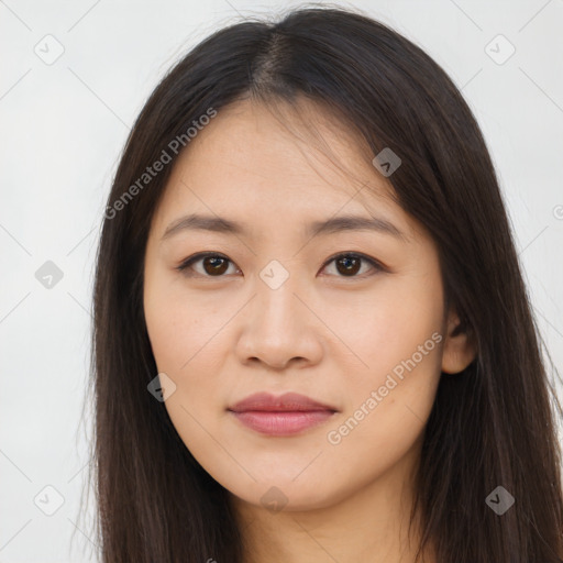 Joyful asian young-adult female with long  brown hair and brown eyes