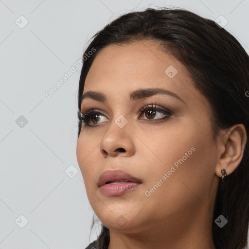 Joyful white young-adult female with long  black hair and brown eyes