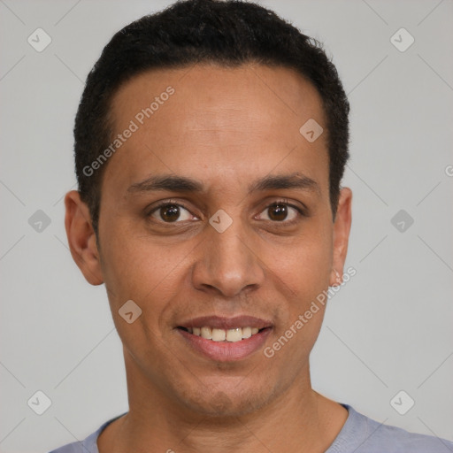 Joyful latino young-adult male with short  black hair and brown eyes