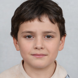 Joyful white child male with short  brown hair and brown eyes