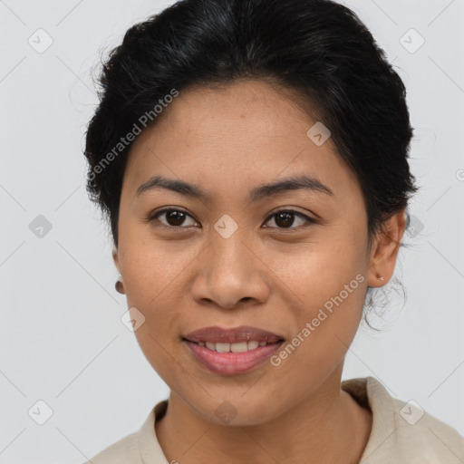 Joyful latino young-adult female with short  brown hair and brown eyes