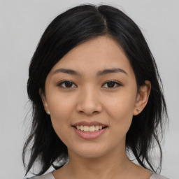 Joyful asian young-adult female with medium  black hair and brown eyes