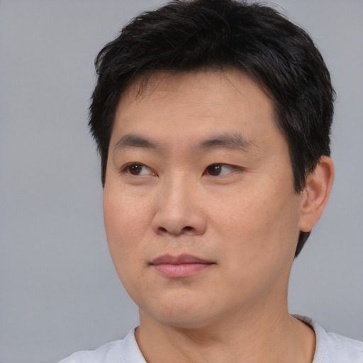 Neutral asian young-adult male with short  black hair and brown eyes