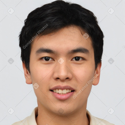 Joyful asian young-adult male with short  black hair and brown eyes