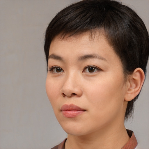 Neutral asian young-adult female with medium  brown hair and brown eyes