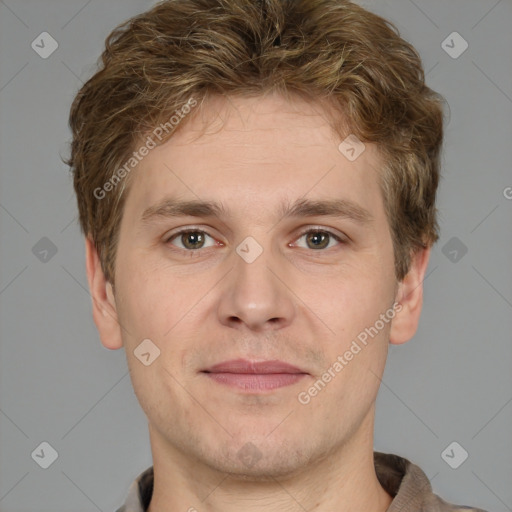 Joyful white adult male with short  brown hair and grey eyes