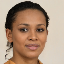 Joyful black young-adult female with short  brown hair and brown eyes