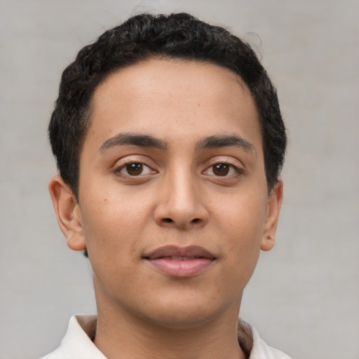 Neutral latino young-adult male with short  brown hair and brown eyes