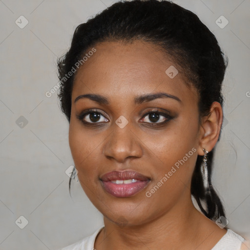 Joyful black young-adult female with medium  black hair and brown eyes