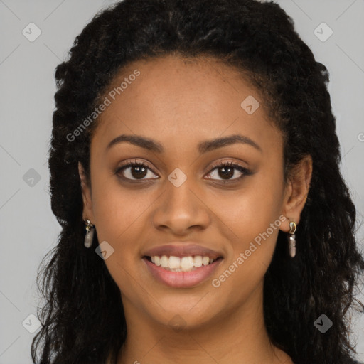 Joyful black young-adult female with long  black hair and brown eyes