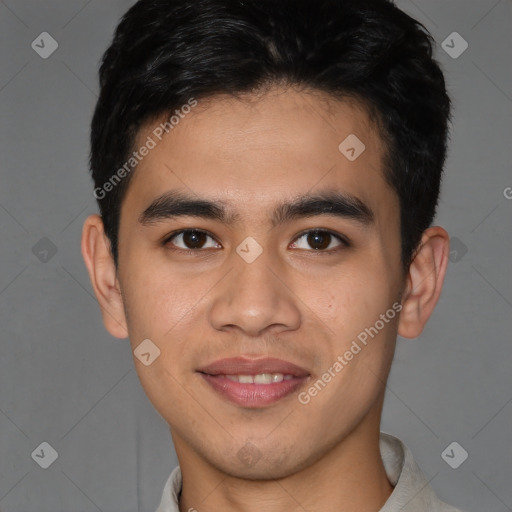 Joyful latino young-adult male with short  brown hair and brown eyes