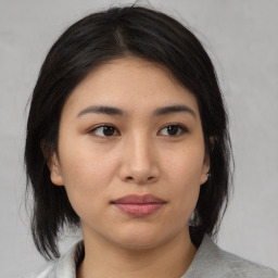 Neutral asian young-adult female with medium  brown hair and brown eyes