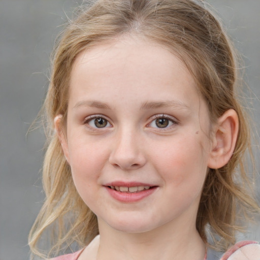 Joyful white child female with medium  brown hair and grey eyes