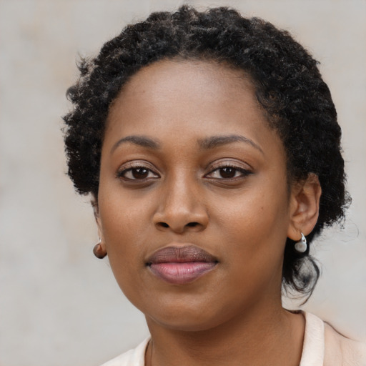 Neutral black young-adult female with short  black hair and brown eyes