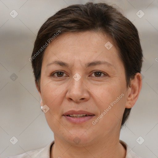 Joyful white adult female with short  brown hair and brown eyes