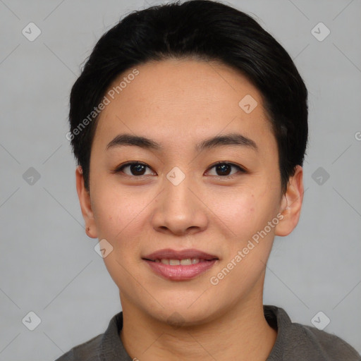 Joyful asian young-adult female with short  black hair and brown eyes