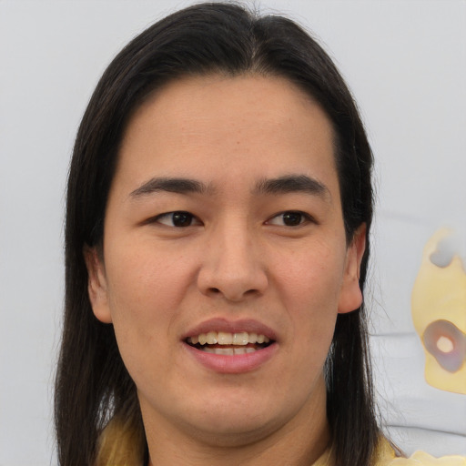 Joyful white young-adult male with long  brown hair and brown eyes