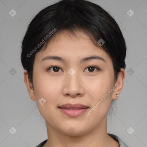 Joyful asian young-adult female with short  brown hair and brown eyes