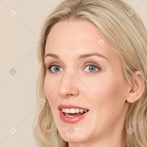 Joyful white young-adult female with long  brown hair and blue eyes