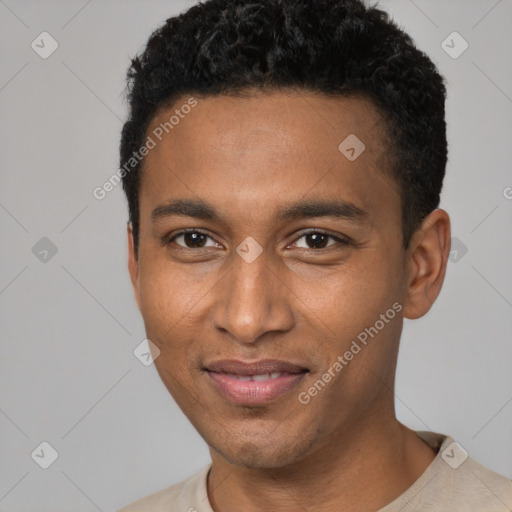 Joyful black young-adult male with short  black hair and brown eyes