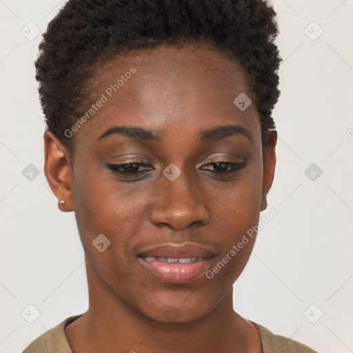 Joyful black young-adult female with short  brown hair and brown eyes