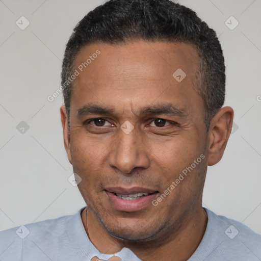 Joyful latino adult male with short  black hair and brown eyes