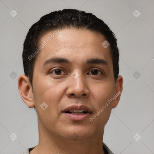 Joyful white young-adult male with short  black hair and brown eyes