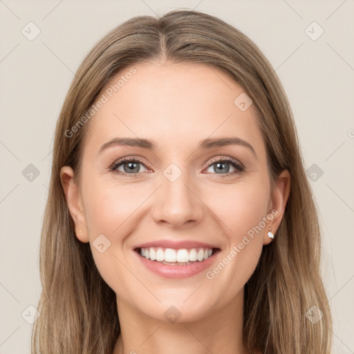 Joyful white young-adult female with long  brown hair and green eyes