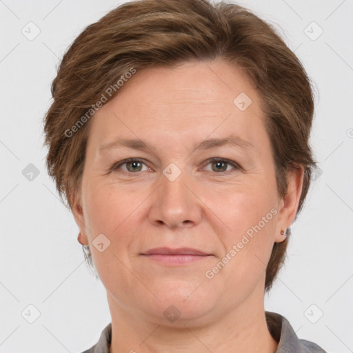 Joyful white adult female with medium  brown hair and grey eyes