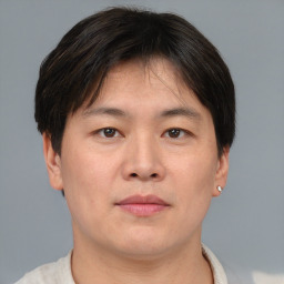 Neutral asian adult male with short  brown hair and brown eyes