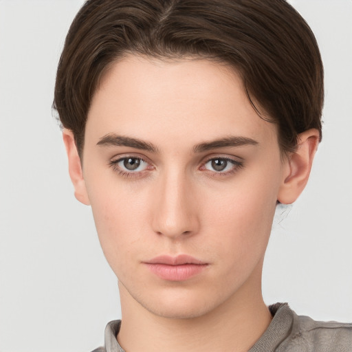 Neutral white young-adult female with short  brown hair and brown eyes