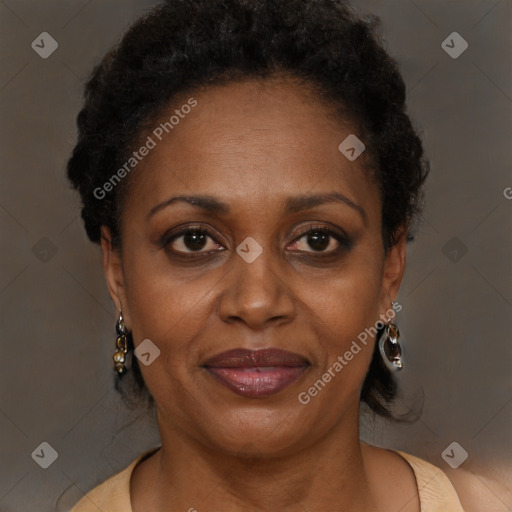 Joyful black adult female with medium  brown hair and brown eyes