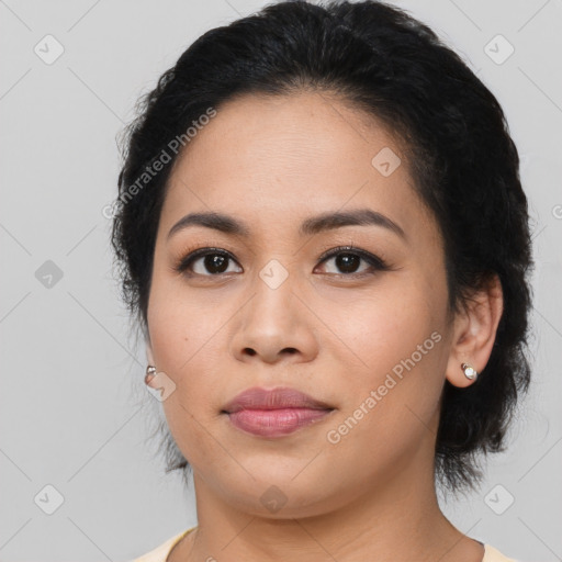 Joyful asian young-adult female with medium  black hair and brown eyes