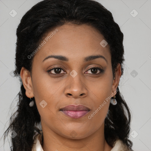 Joyful black young-adult female with long  brown hair and brown eyes