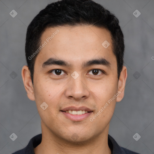 Joyful latino young-adult male with short  brown hair and brown eyes