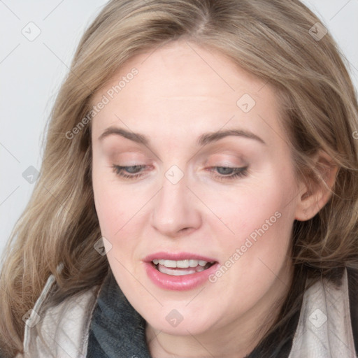 Joyful white young-adult female with medium  brown hair and blue eyes