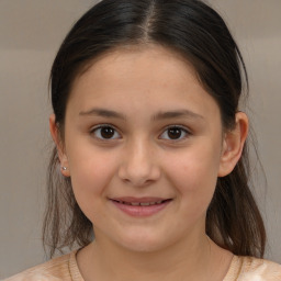 Joyful white child female with medium  brown hair and brown eyes