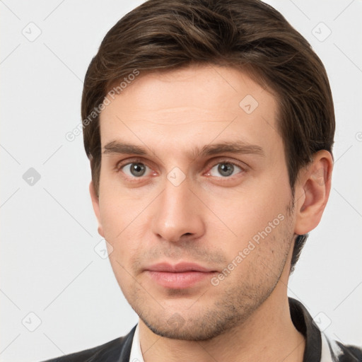 Neutral white young-adult male with short  brown hair and grey eyes