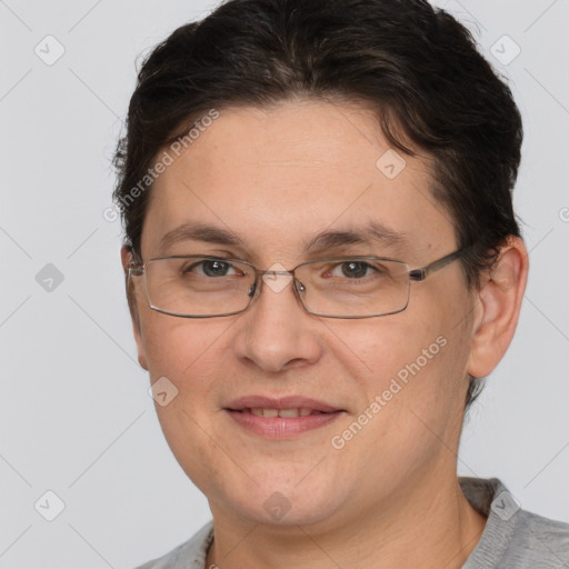 Joyful white adult female with short  brown hair and brown eyes