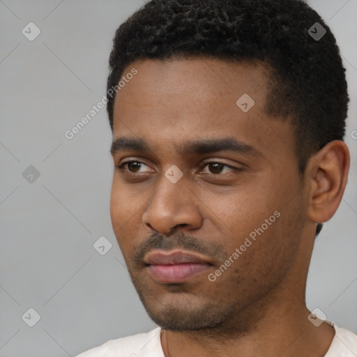 Neutral black young-adult male with short  black hair and brown eyes