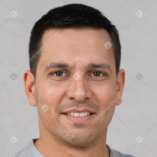 Joyful white adult male with short  brown hair and brown eyes