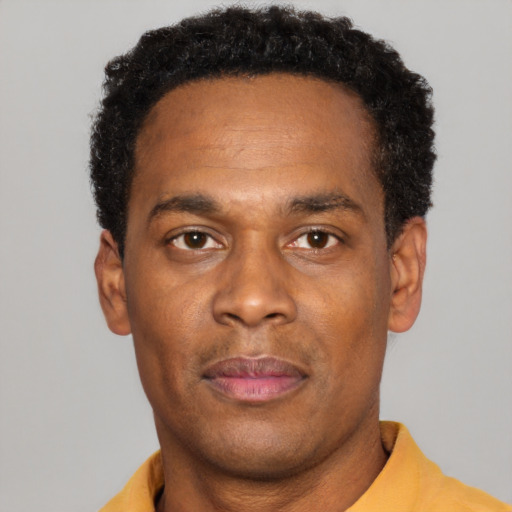 Neutral black adult male with short  black hair and brown eyes